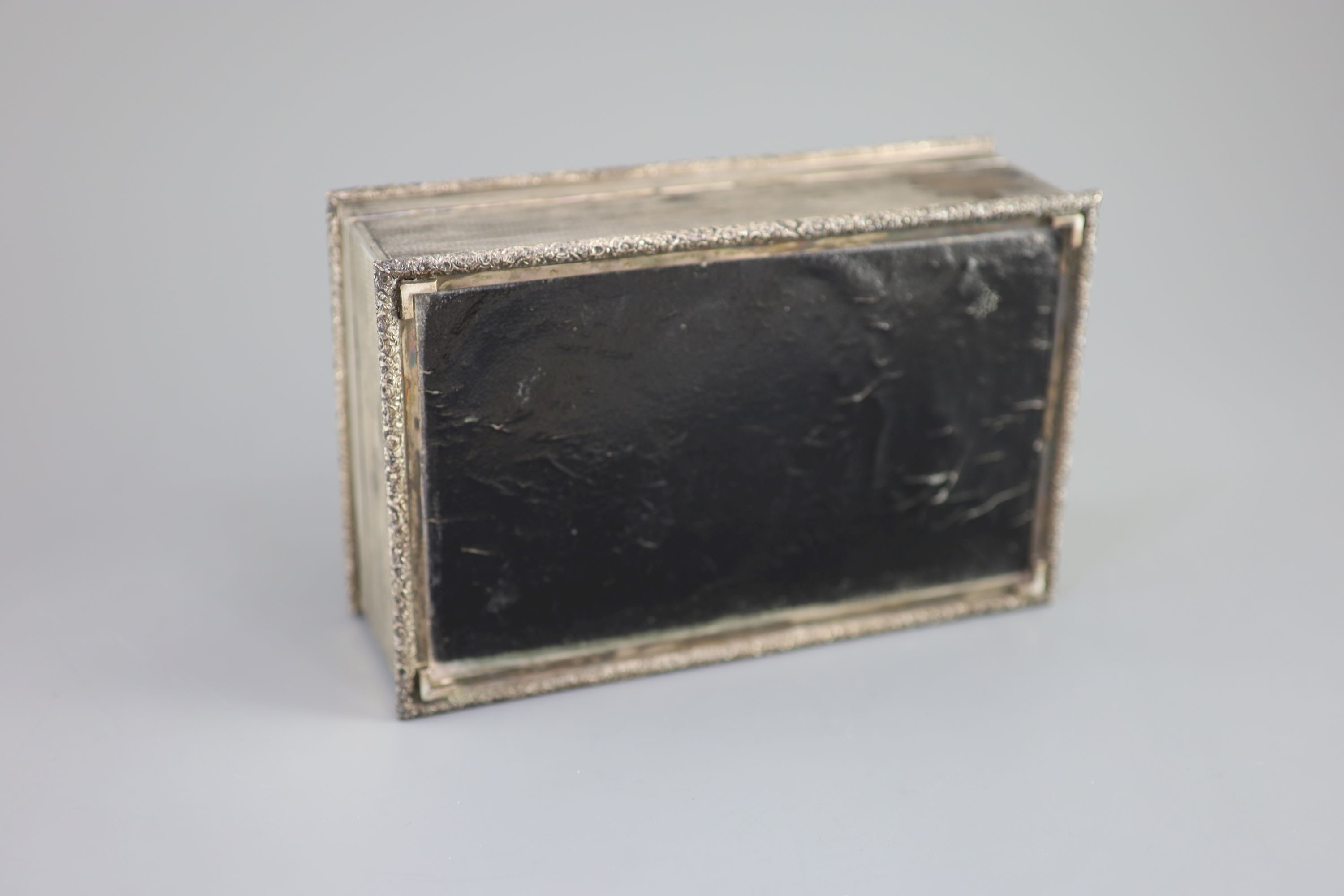 A 1950's engine turned silver rectangular cigarette box, by Mappin & Webb, 21.1cm, gross 35oz.